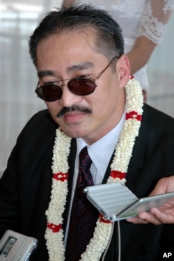 FILE - Khmer Republican Party of Cambodia President Lon Rith, son of Lon Nol who ruled Cambodia from 1970 to 1975, talks to reporters on his arrival at Phnom Penh International Airport, Phnom Penh, Cambodia, April 20, 2008.
