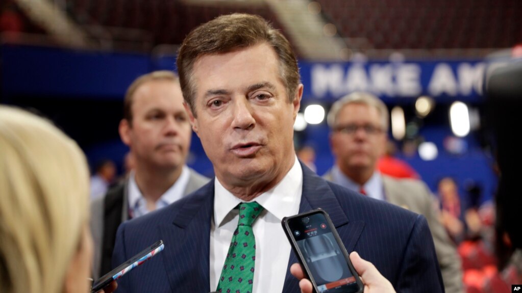 FILE - In this July 17, 2016 file photo, Trump Campaign Chairman Paul Manafort talks to reporters on the floor of the Republican National Convention in Cleveland. 