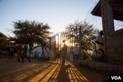 Many come and go freely outside Mother of mercy hospital. Nuba Mountains. (Adam Bailes/VOA News)