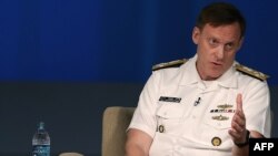 U.S. Navy Admiral Michael Rogers, who heads U.S. Cyber Command and the National Security Agency, urges timely access to data. He's shown speaking at a forum in Washington, D.C, May 11, 2015. 