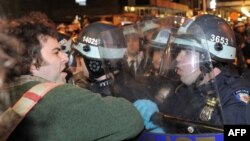 U.S. -- A man is confronted by New York Police Department officers as New York City officials clear the 'Occupy Wall Street' protest from Zuccotti Park, November 12, 2011.