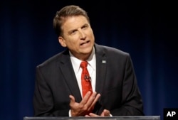 FILE - North Carolina Republican Gov. Pat McCrory participates in a gubernatorial debate with Democratic challenger Attorney General Roy Cooper, October 11, 2016.