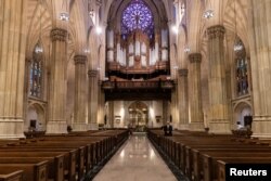 Empty seats are seen during an Easter service at St. Patrick's Cathedral as the outbreak of the coronavirus disease (COVID-19) continues in the Manhattan borough of New York City, New York, U.S., April 12, 2020. (REUTERS/Jeenah Moon)