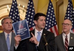 House Speaker Paul Ryan, R-Wis., center, stands with Greg Walden, R-Ore., right, and House Majority Whip Kevin McCarthy, R-Calif., during a news conference on the American Health Care Act on Capitol Hill.
