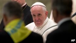 Pope Francis meets with members of the Don Guanella charity organization at the Vatican, Nov. 12, 2015. The flare-up of Vatican scandals doesn't seem to have disturbed the pontiff. 