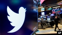 FILE - The logo for Twitter is displayed above a trading post on the floor of the New York Stock Exchange on Feb. 8, 2018. 