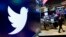 FILE - The logo for Twitter is displayed above a trading post on the floor of the New York Stock Exchange on Feb. 8, 2018. 