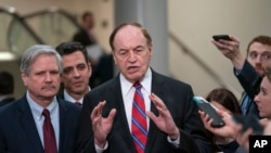 From left, Sen. John Hoeven, R-N.D., Rep. Tom Graves, R-Ga., and Sen. Richard Shelby, R-Ala., of the bipartisan group of bargainers working to craft a border security compromise, speak with reporters on Capitol Hill in Washington, Feb. 6, 2019. 