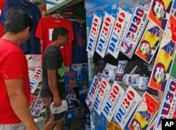 Customers walk in a shop selling souvenir items such as commemorative car plates, t-shirts, stickers of leading presidential candidate Mayor Rodrigo Duterte sell as business resumes at his hometown in Davao city in southern Philippines, May 11, 2016.