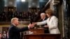 President Donald Trump, before delivering the State of the Union address, shakes the hand of Speaker of the House Nancy Pelosi. Vice President Mike Pence, center, is also in attendance at the Capitol in Washington, February 5, 2019. 