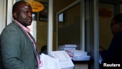 FILE - Tinomudaishe Chinyoka, one of the lawyers representing ZANU PF's Presidential candidate Emmerson Mnangagwa, arrives to file opposing papers at the Constitutional Court in Harare, Zimbabwe, Aug. 15, 2018.