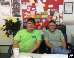 Albert Adams and Leslie Arthur, who own Big Al's Auto and Small Engine Repair, sit in their offices in Logan, West Virginia, May 11, 2016. They quit their jobs in the mines when they figured the industry wouldn't bounce back and started this shop to try to build a life after coal.