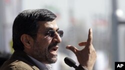 Iranian President Mahmoud Ahmadinejad gestures as he deliver his speech at a rally to mark the 33rd anniversary of the Islamic Revolution, Tehran, Feb. 11, 2012.