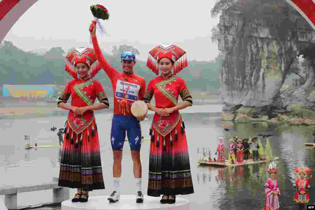 Enric Mas of Spain celebrates after winning the Tour of Guangxi cycling race in Guilin, in China&#39;s southern Guangxi region.