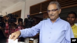 East Timor President Jose Ramos-Horta casts his ballot during the presidential election in Dili, East Timor, Saturday, March 17, 2012. 