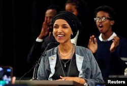 Democratic congressional candidate Ilhan Omar reacts after appearing at her midterm election night party in Minneapolis, Minnesota, Nov. 6, 2018.