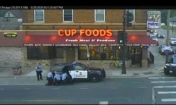 FILE - Minneapolis police officers from left, Tou Thao, Derek Chauvin, J. Alexander Kueng and Thomas Lane are seen attempting to take George Floyd into custody in Minneapolis, Minn., in this May 25, 2020 file image from surveillance video.