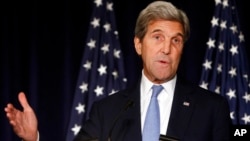 FILE - Secretary of State John Kerry speaks in New York. Kerry is threatening to cut off all contacts with Moscow over Syria, unless Russian and Syrian government attacks on Aleppo end. 