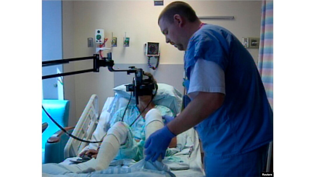 FILE - A hospital patient uses virtual reality treatment for pain in this undated photo.