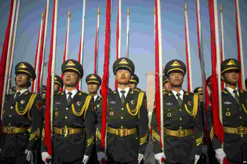 Flagbearers of a Chinese honor guard stand in formation before a welcome ceremony for Argentina&#39;s President Mauricio Macri at the Great Hall of the People in Beijing.