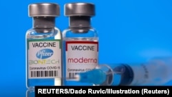 FILE PHOTO: Vials with Pfizer-BioNTech and Moderna coronavirus disease (COVID-19) vaccine
