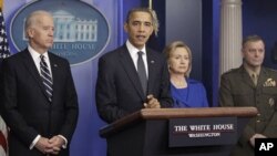 President Obama discusses the yearly report on progress in Afghanistan. He was joined by Vice President Joe Biden, left, Secretary of State Hillary Clinton and Joint Chiefs Vice Chairman Marine General James Cartwright