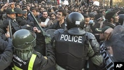 Iranian police prevent some protesters from entering the British Embassy, in Tehran, Iran, November 29, 2011.