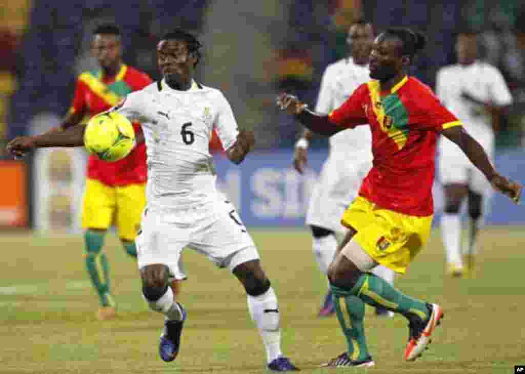 Ghana's Annan Anthony (L) controls the ball during their African Cup of Nations Group D soccer match against Guinea at Franceville stadium February 1, 2012.