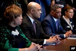 FILE - Congressional Black Caucus members meet with President Donald Trump (not pictured) in the Cabinet Room of the White House in Washington, March 22, 2017. Along with activists, caucus members are expressing concern activists Trump is reversing Obama's legacy.