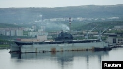FILE - Russian aircraft carrier Admiral Kuznetsov is seen at a shipyard in the town of Roslyakovo, near Murmansk, Russia, June 19, 2006.