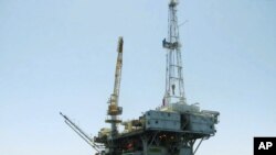 FILE - Representative illustration of an offshore oil drilling and production platform. Image taken 4.17.2017
