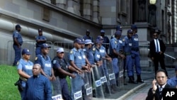 Police secure the entrance to the High Court in Durban South Africa, April 6, 2018. 