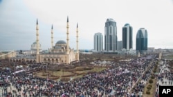 Chechen demonstrators gathered during a massive rally in Grozny, Chechnya Republic, in support of strongman leader Ramzan Kadyrov and Russian President Vladimir Putin, Jan. 22, 2016.