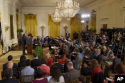 President Barack Obama makes opening remarks during news conference in the East Room of the White House, Washington, July 15, 2015.