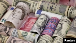 Euro, Hong Kong dollar, U.S. dollar, Japanese yen, British pound and Chinese 100-yuan banknotes are seen in a picture illustration shot, Jan. 21, 2016. 