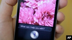 FILE - Siri, the new virtual assistant, is displayed on the new Apple iPhone 4S in San Francisco, California.