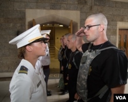 A new cadet reports to the cadet in the red sash during the U.S. Military Academy at West Point’s Reception Day, June 27, 2016. (U.S. Army photo by: Staff Sgt. Vito T. Bryant)