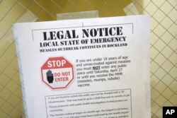 A sign explaining the local state of emergency because of a measles outbreak at the Rockland County Health Department in Pomona, N.Y., March 27, 2019.