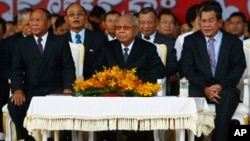 From left: Cambodian National Assembly President Heng Samrin, Senate President Chea Sim, Prime Minister Hun Sen, attend ceremony, Phnom Penh, Jan. 7, 2014.