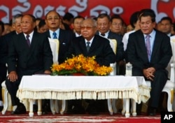 From left: Cambodian National Assembly President Heng Samrin, Senate President Chea Sim, Prime Minister Hun Sen, attend ceremony, Phnom Penh, Jan. 7, 2014.