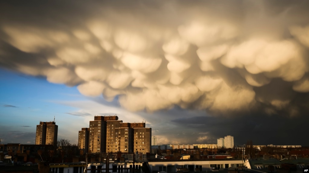 Clouds cover the sky over the Ernst-Taehlmann-Park housing estate after a thunderstorm in Berlin, Germany, Thursday, March 11, 2021. (AP Photo/Markus Schreiber)