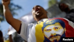 A supporter of jailed opposition leader Leopoldo Lopez shouts slogans Dec. 6, 2016, during a protest calling for the government of Venezuela's President Nicolas Maduro to order the release of political prisoners. 