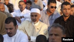 Mohammed Magarief, center, then-president of the Libyan national assembly, attends Eid al-Fitr prayers in Benghazi in this August 19, 2012, file photo.