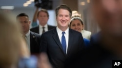 FILE - Supreme Court nominee Judge Brett Kavanaugh arrives for a meeting on Capitol Hill in Washington, July 30, 2018.