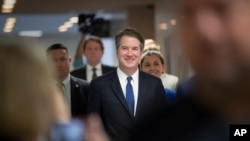FILE - Supreme Court nominee Judge Brett Kavanaugh, President Donald Trump's choice to replace retiring Justice Anthony Kennedy, arrives on Capitol Hill in Washington, July 30, 2018.