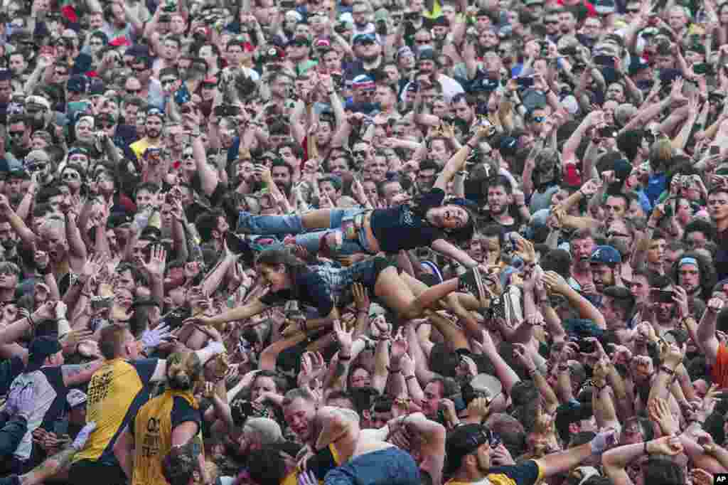 Festival goers crowdsurf at Rock On The Range Music Festival in Columbus, Ohio, May 20, 2017.