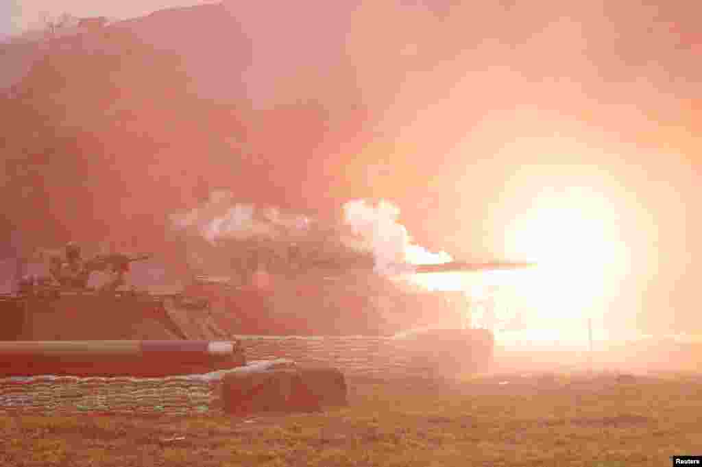 A Taiwanese M60A3 tank fires off blank shells during a military drill in Hualien, eastern Taiwan.