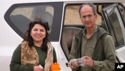 Undated photo provided by the family of late Iranian-Canadian professor Kavous Seyed-Emami, shows him and his wife, Maryam Mombeini, in an unidentified place in Iran. 