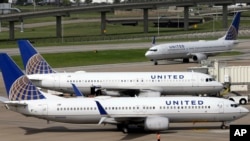 In this July 8, 2015, file photo, United Airlines planes are seen on the tarmac at the George Bush Intercontinental Airport in Houston. (AP Photo/David J. Phillip, File)