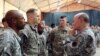 ژنرال ماترین دمپسی رئیس ستاد مشترک ارتش ایالات متحده (راست) در جمع نظامیان آمریکایی در فرودگاه بین‌المللی بغداد – ۲۴ آبان ۱۳۹۳ 